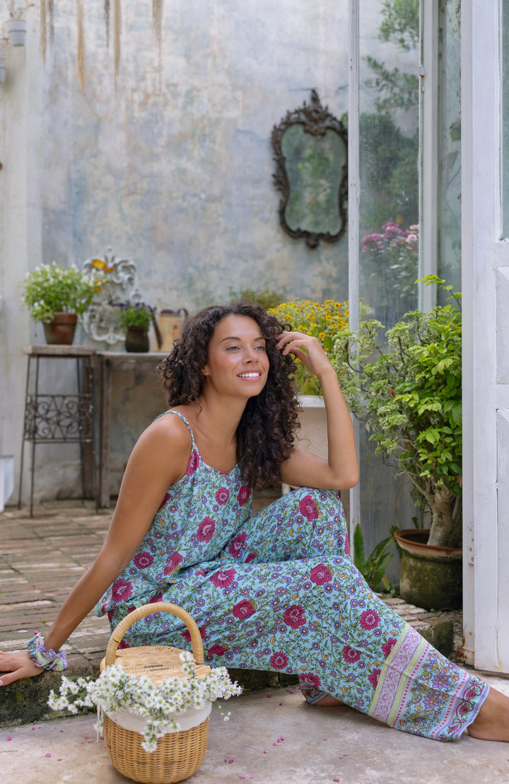 Woman wearing boho PJ set, sitting down
